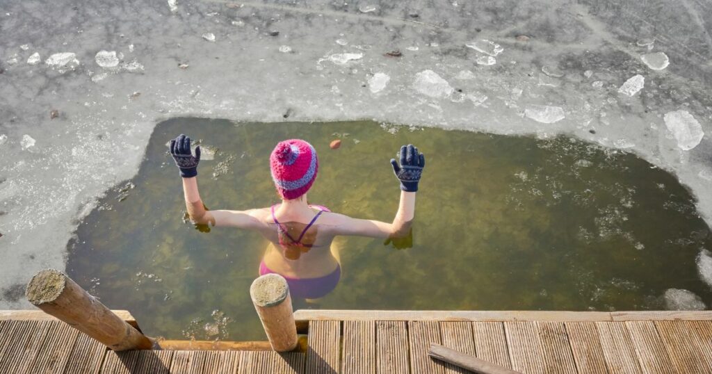 a woman taking the ice plunge challenge