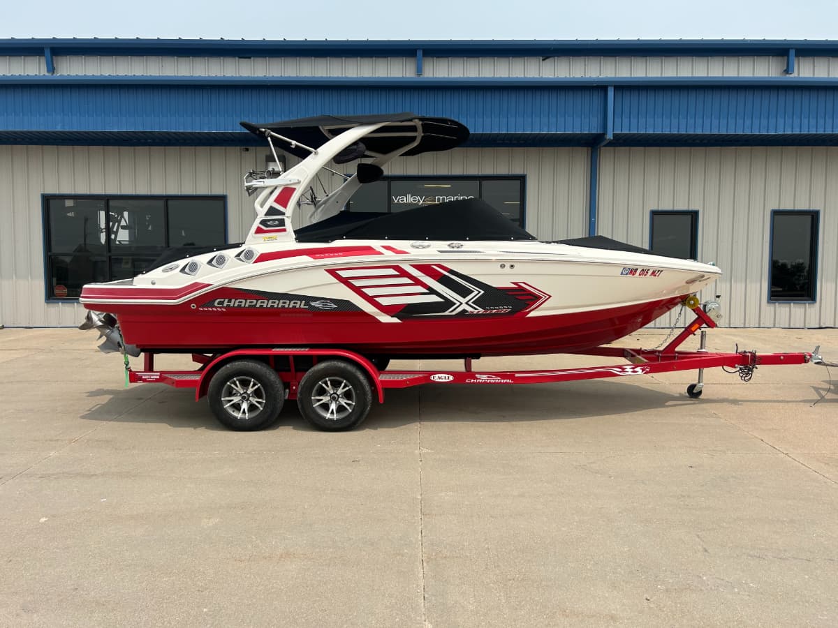 Side view of white and red 2017 Malibu 21 VLX.